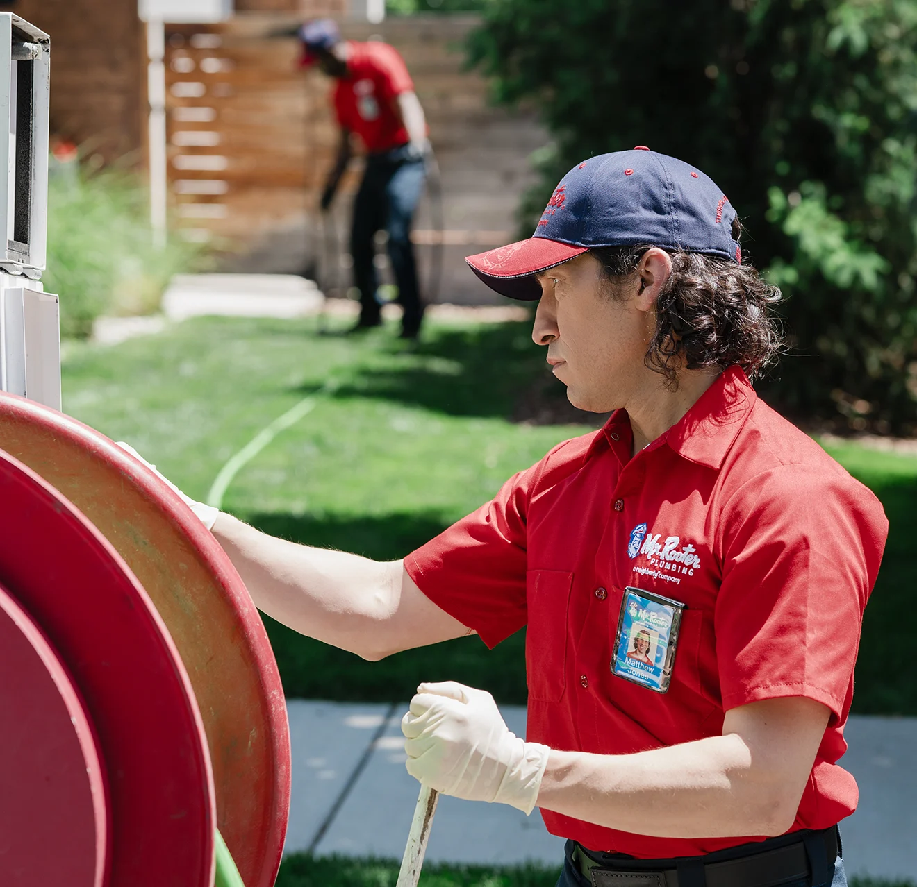 A Mr. Rooter plumbing professional at work.