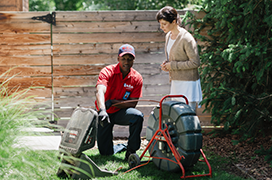 Mr. Rooter professional fixing a sewer line.