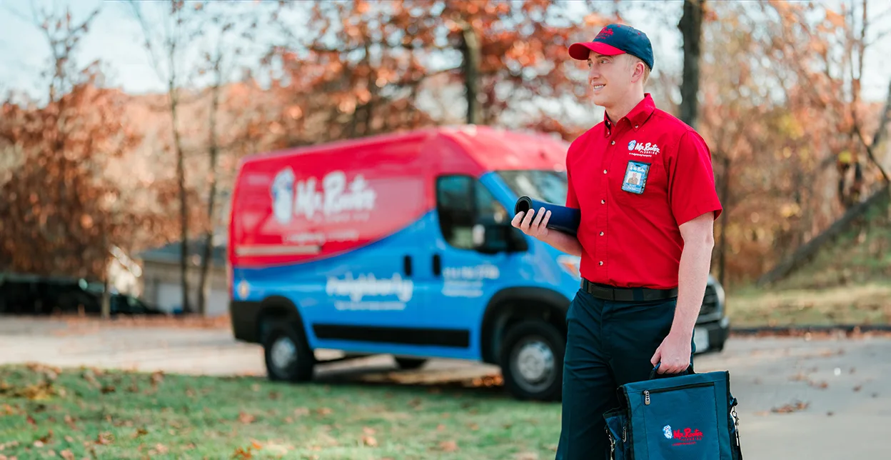 Mr. Rooter technician walking up to a customer's home.