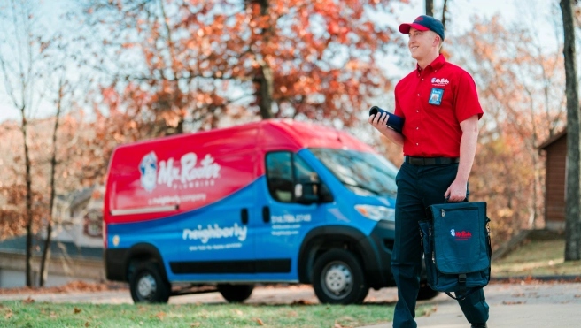 Mr. Rooter professional walking up to a customer's home.