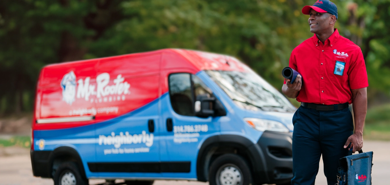 Mr. Rooter Professional walking up to a customer's home.