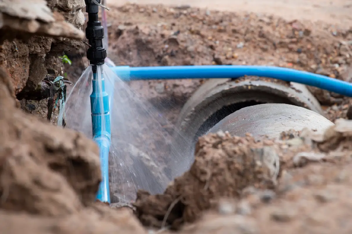 Photograph of a pipe burst underground.