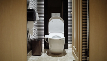 Motion sensor toilet in public restroom | Mr. Rooter Plumbing of South Jersey