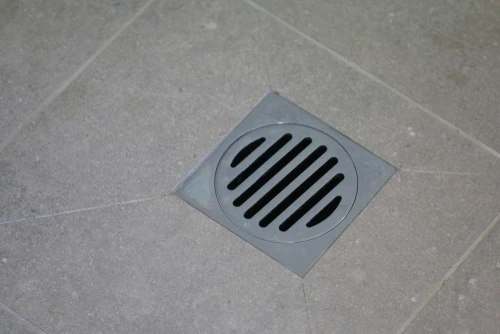 A clean basement floor drain.
