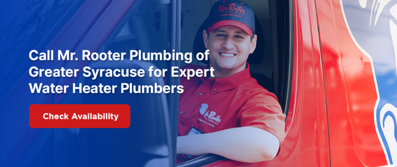Male Mr. Rooter plumbing service technician smiling through service van window.