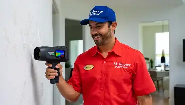 Mr. Rooter professional detecting a hidden leak in a home.